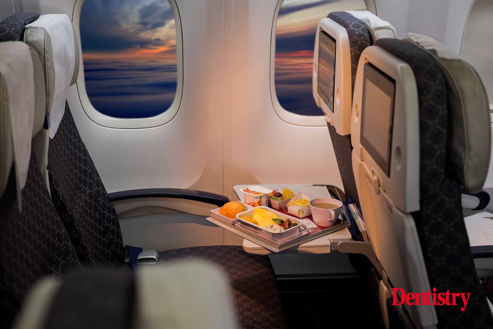 A woman was left waiting for a response from British Airways after finding a loose dental implant in her plane meal.